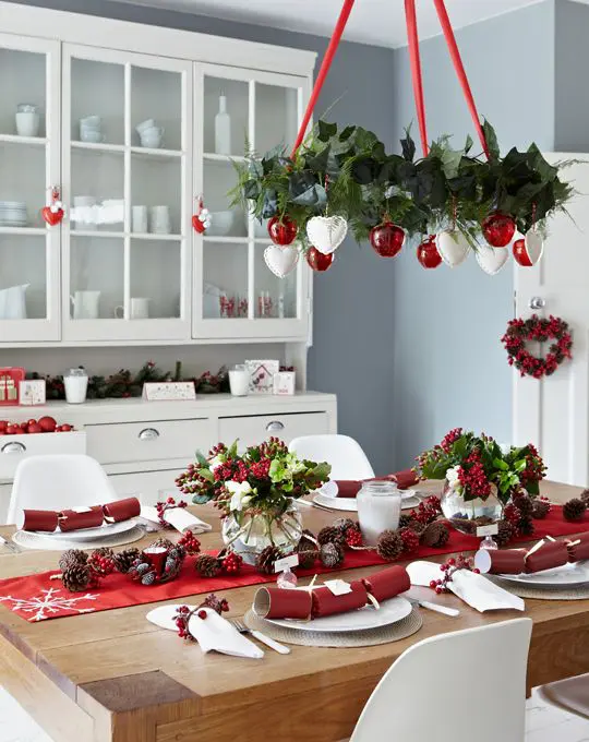 03-a-red-and-white-christmas-chandelier-a-red-table-runner-and-berries-for-decor