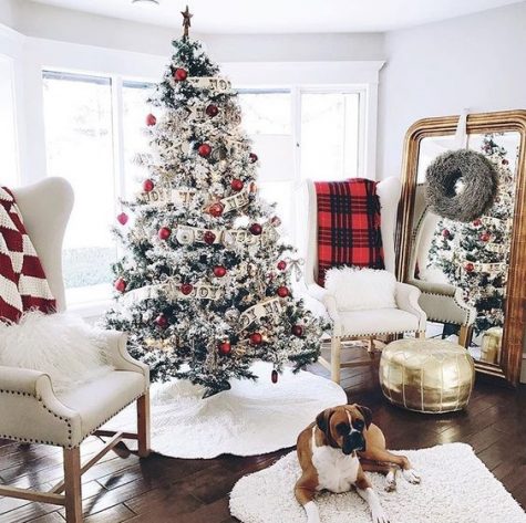 06-a-farmhouse-christmas-nook-with-a-flocked-tree-with-red-and-white-ornaments-plaid-blankets-and-white-fur