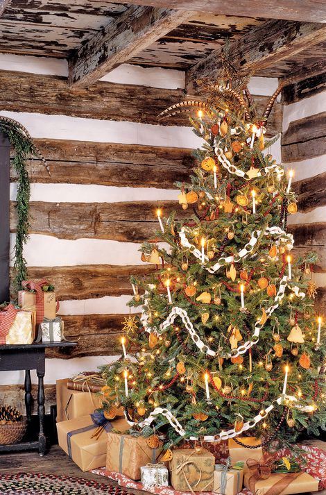 A-vintage-christmas-tree-decorated-with-lights-citrus-slices-stars-cranberry-garlands-paper-chains-and-other-stuff