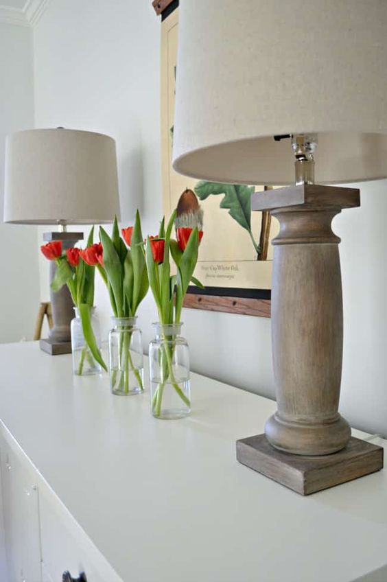 Clear-bottles-with-red-tulips-is-a-simple-and-modern-spring-arrangement-with-bright-touches-of-color